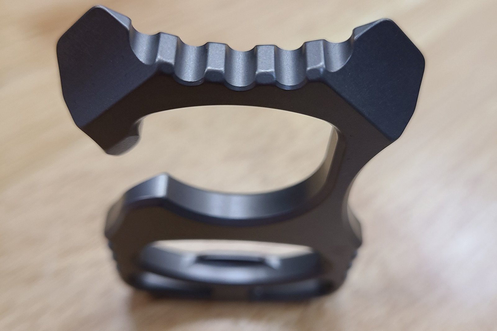 Macro of chamfered edges and jimping on a titanium part