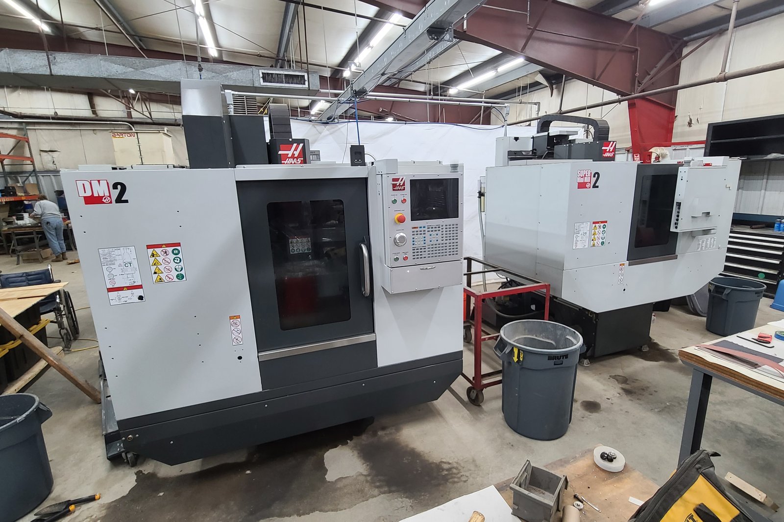 Two Haas machining centers on the shop floor